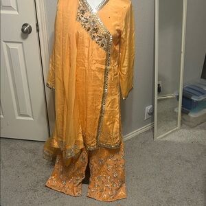 Orange shalwar kameez Duppatta. Mirror lacing. Net embroidery trousers. S